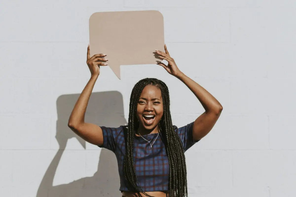 Woman holding speech bubble