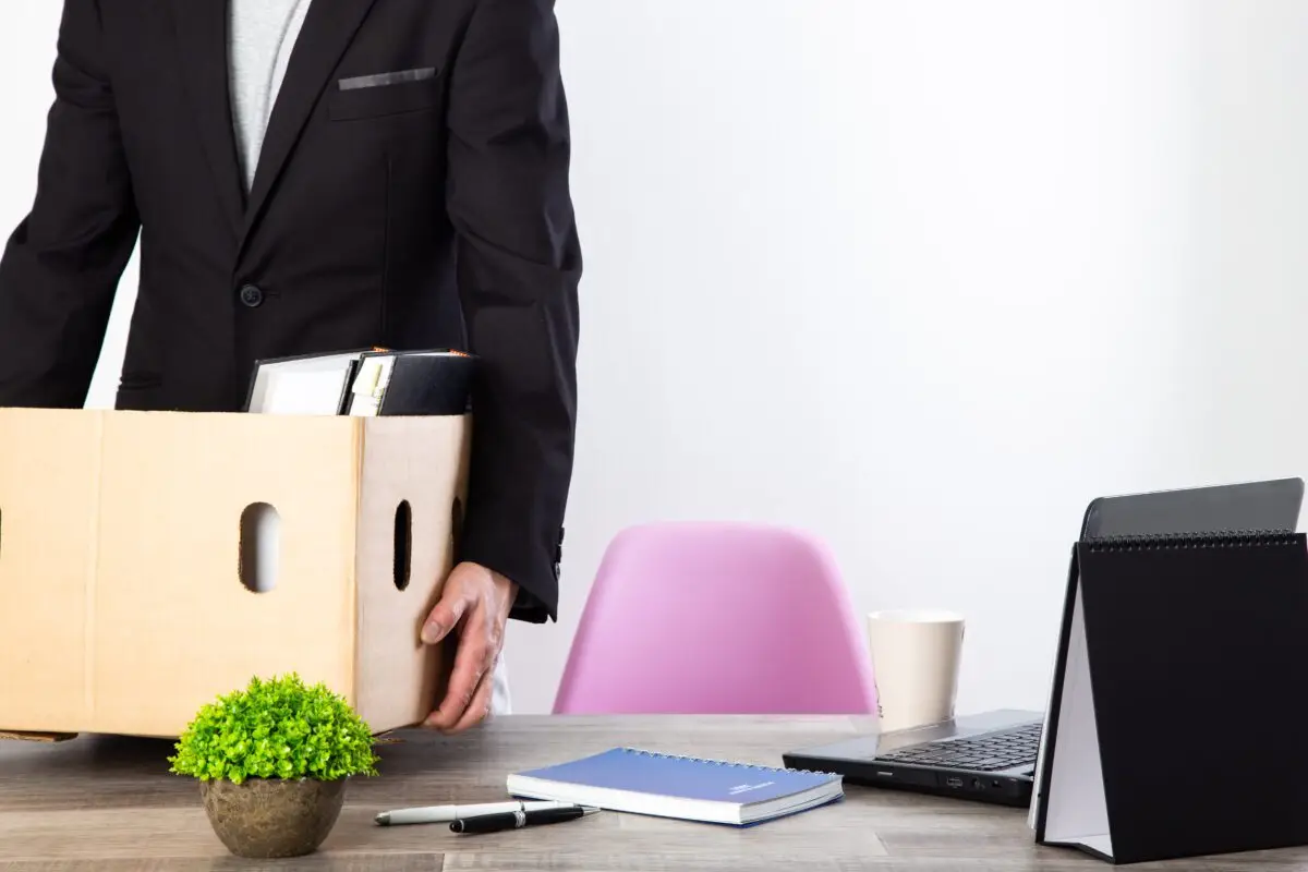man packing his belonging after resign