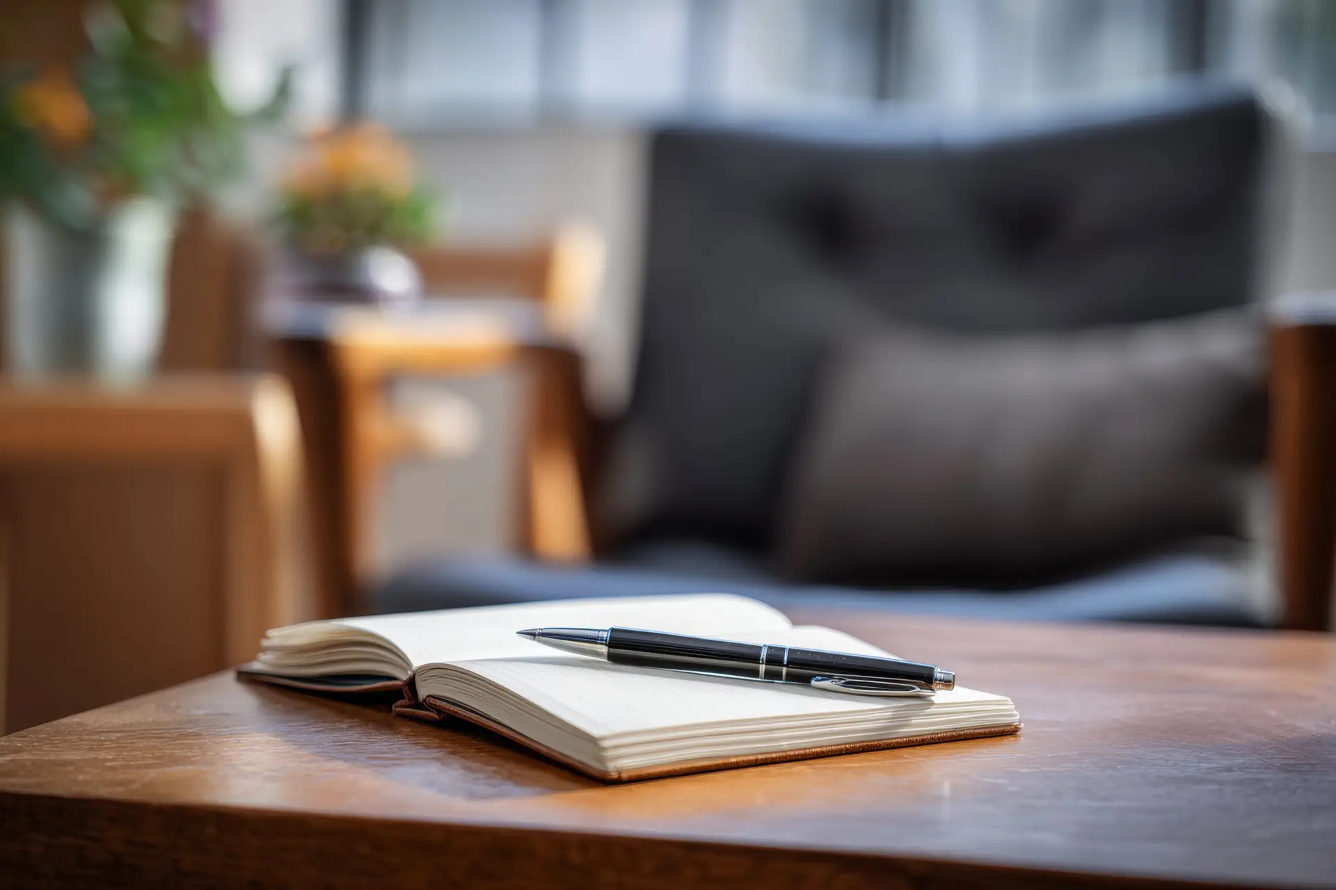 Diverse professionals speaking with a therapist in a calm modern office
